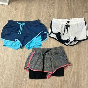 Three pairs of Champion running shorts
